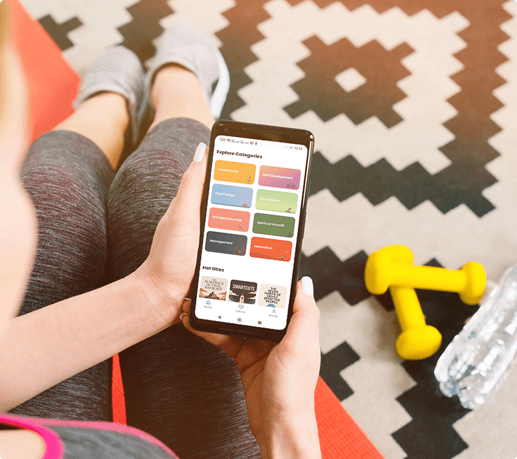 Phone displaying app on a lifestyle background